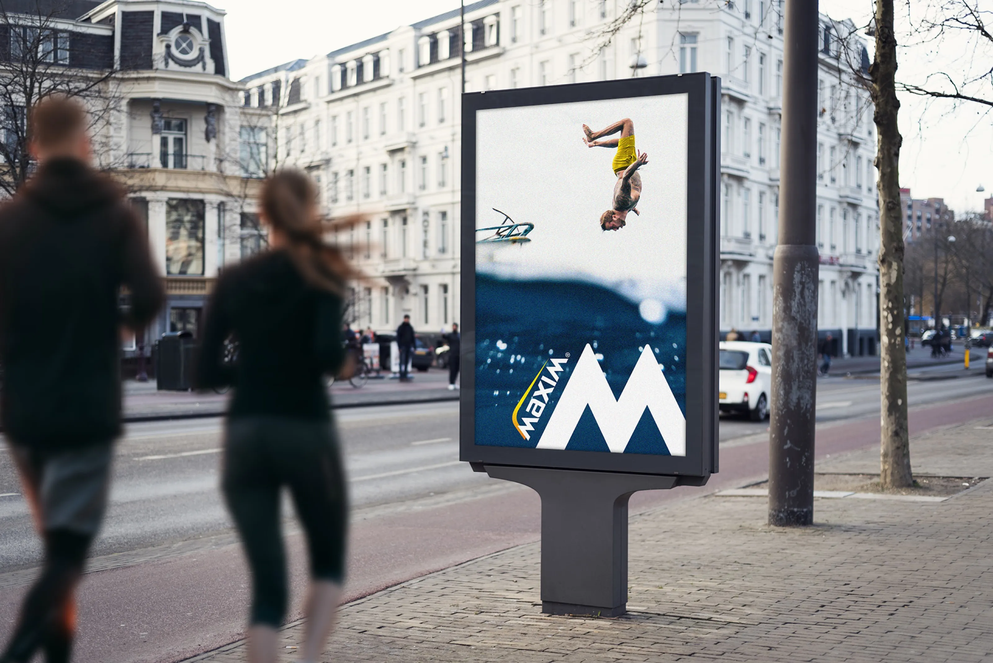 Maxim street poster of a diver mid-flip above the sea, with joggers passing by