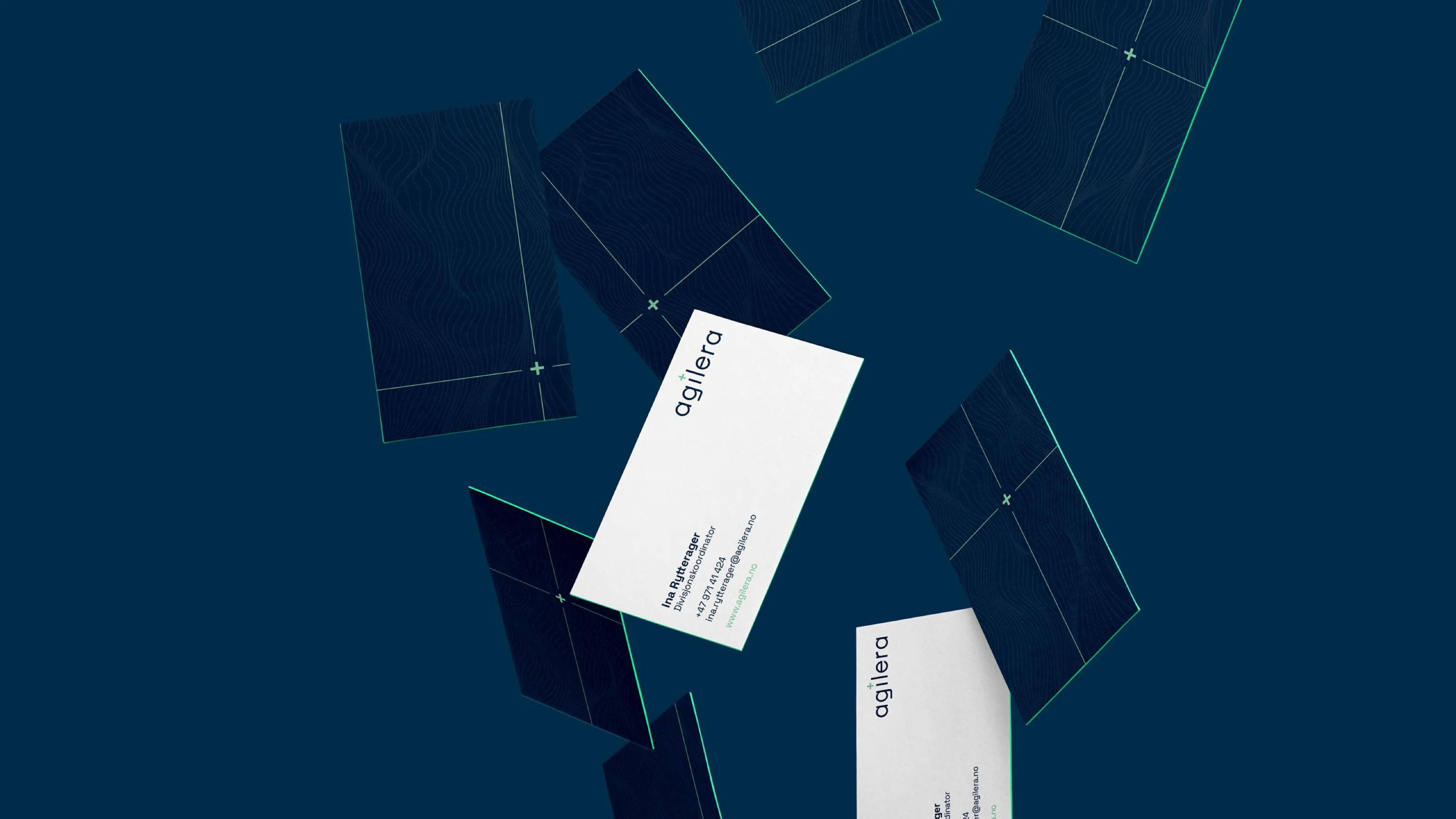 Agilera business cards in white and deep blue with a crosshair pattern, floating on a blue background
